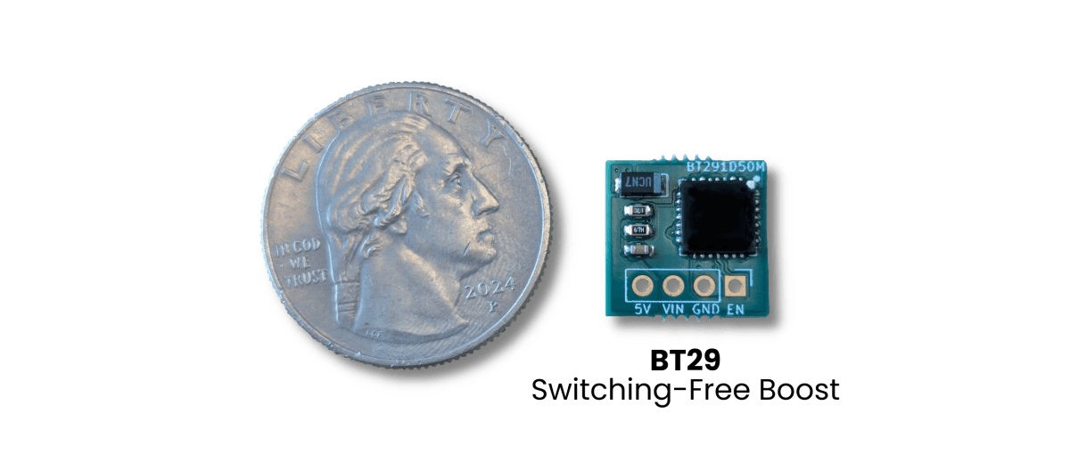 Small green BT29 switching-free boost demonstration board labeled BT291D50M, with 5V, VIN, GND, and EN pads, shown next to a US quarter that dwarfs it for scale.